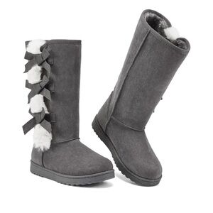 NWT. Size 6. Grey faux suede mid-calf boots with faux fur and bow trim